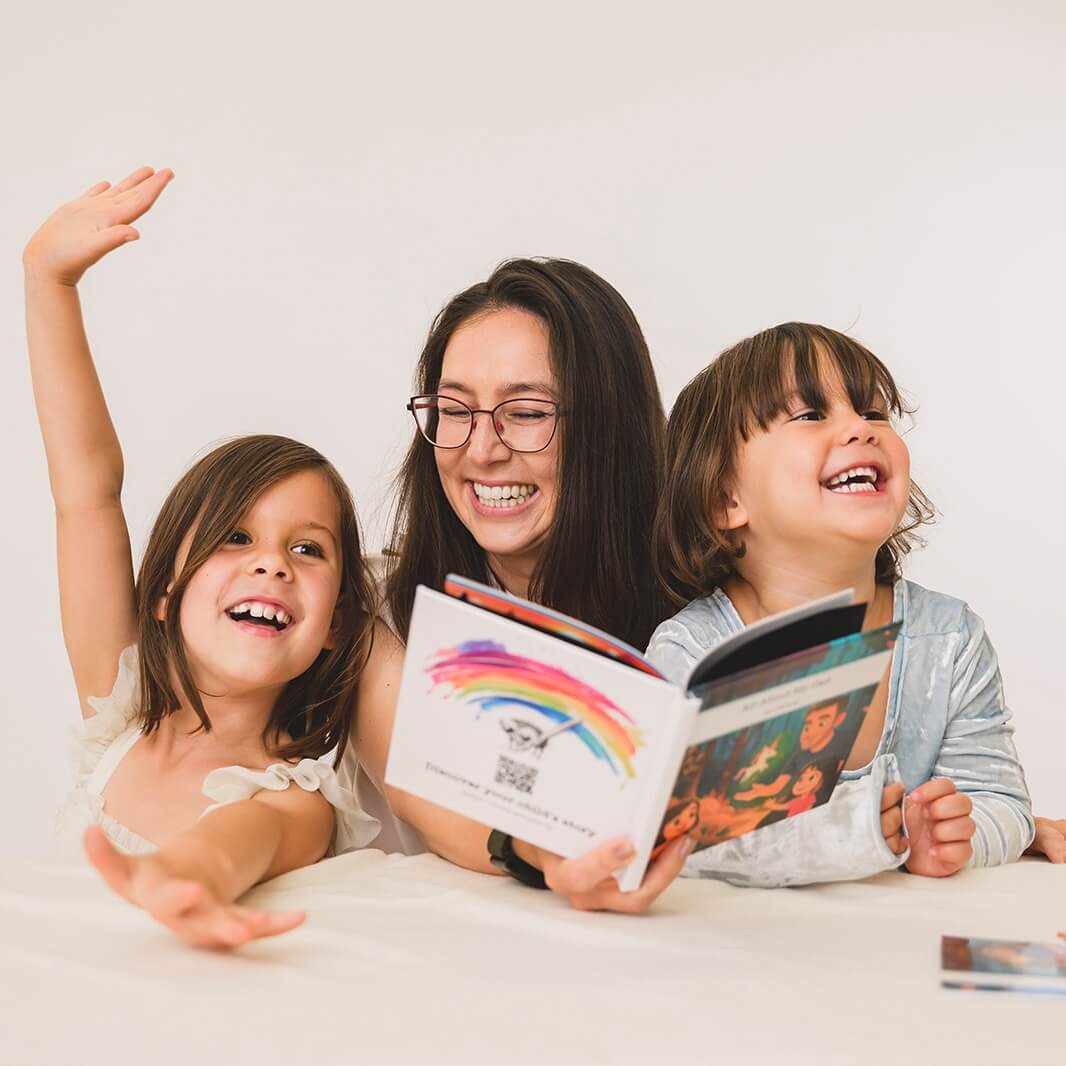 Laura and her two children reading a Wanderly book together